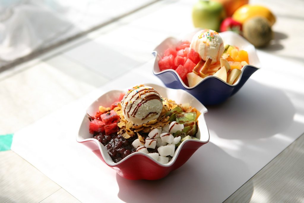 two bowls of korean dessert patbingsu on a table